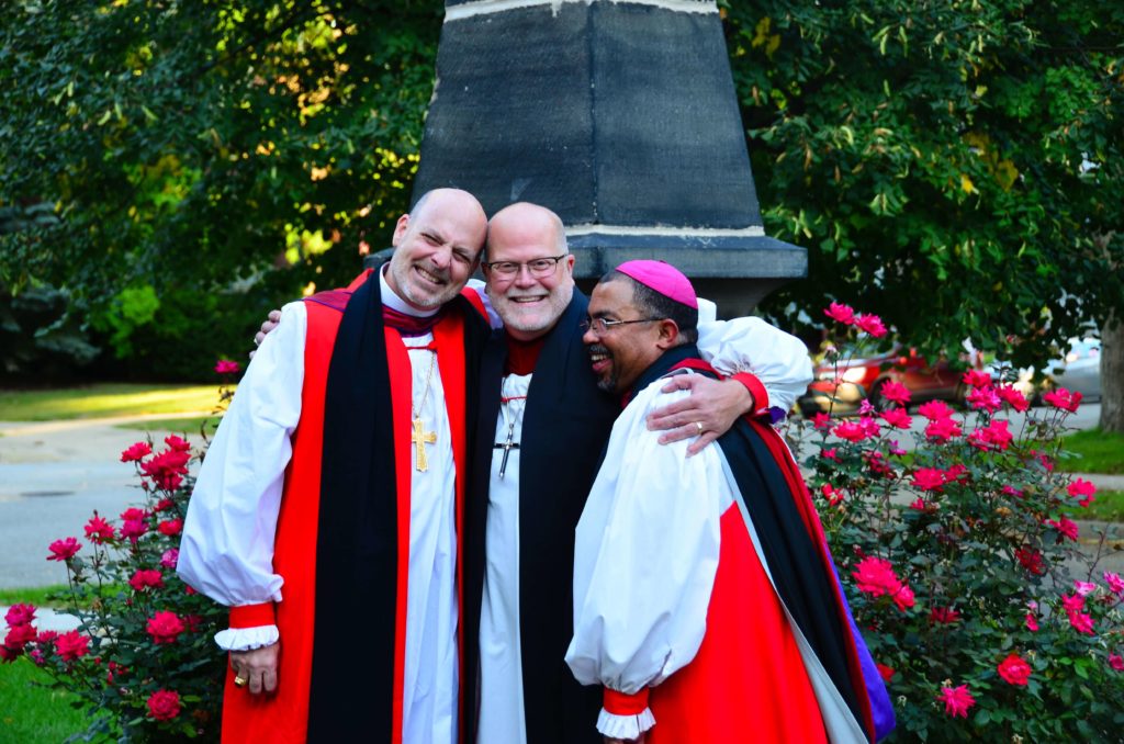 The three bishops of Michigan's Lower Peninsula pose for a photo after Evensong.