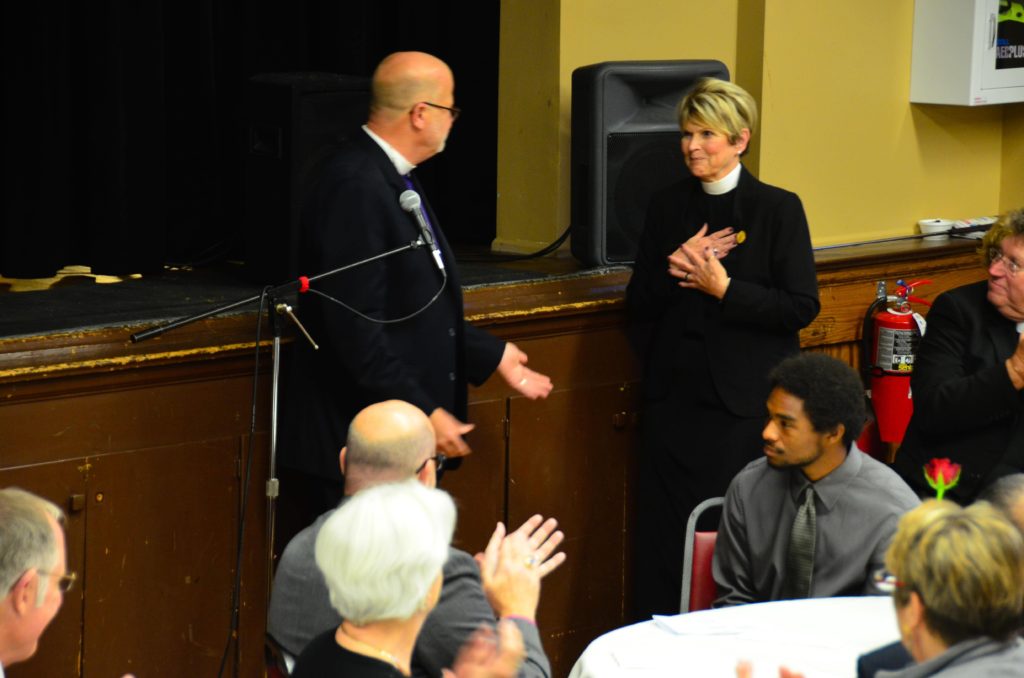 The Ven. Anna Leigh Kubbe, recently retired archdeacon, accepts the first Swords into Plowshares Award.