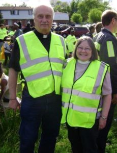 The Rev. Sarah Parks and the Rev. Larry Parks, Deacon pose for a photo at Light up the City in Flint.