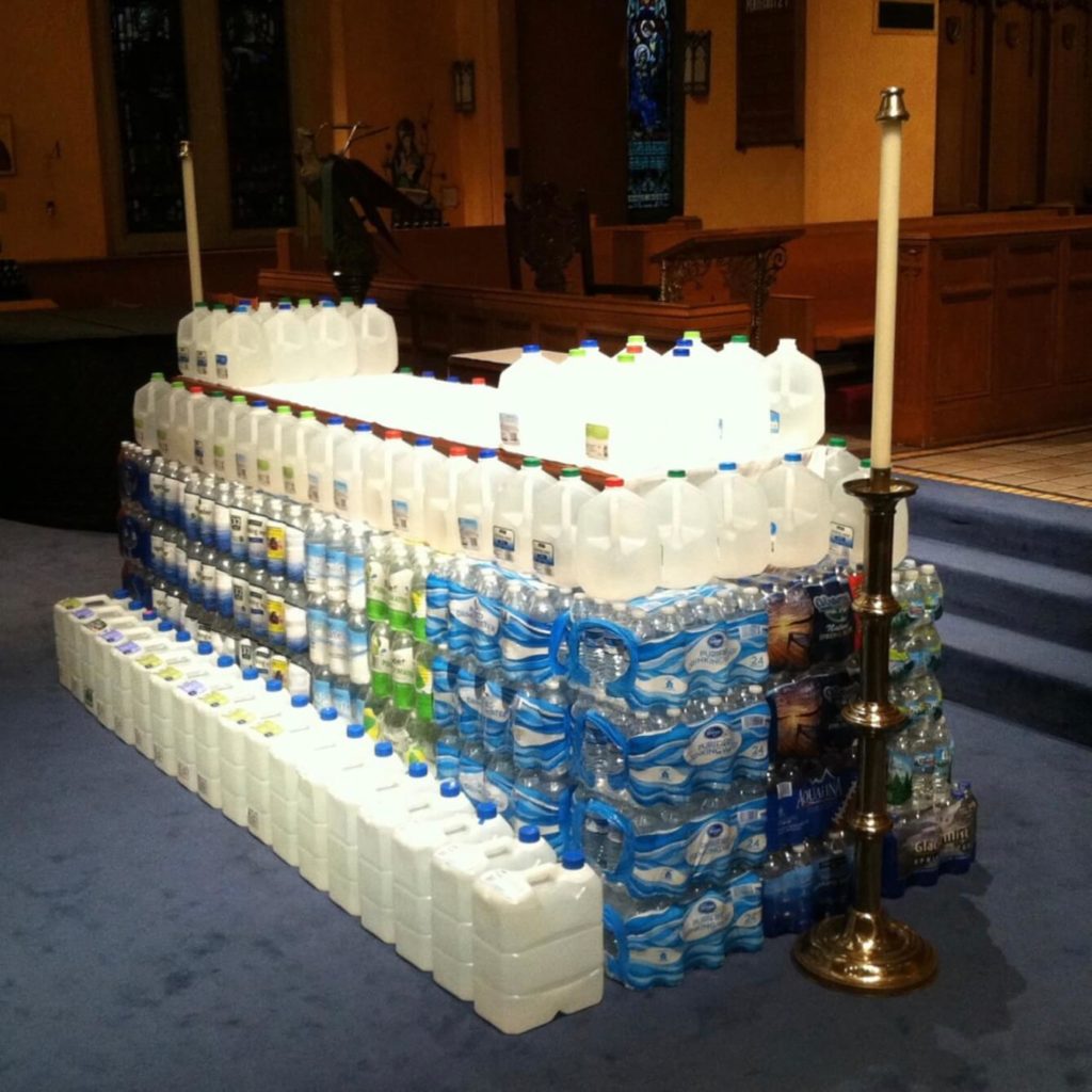 Donated water surrounds the altar at St. Paul's Episcopal Church in Flint after the closing Eucharist of the 21st Diocesan Convention.