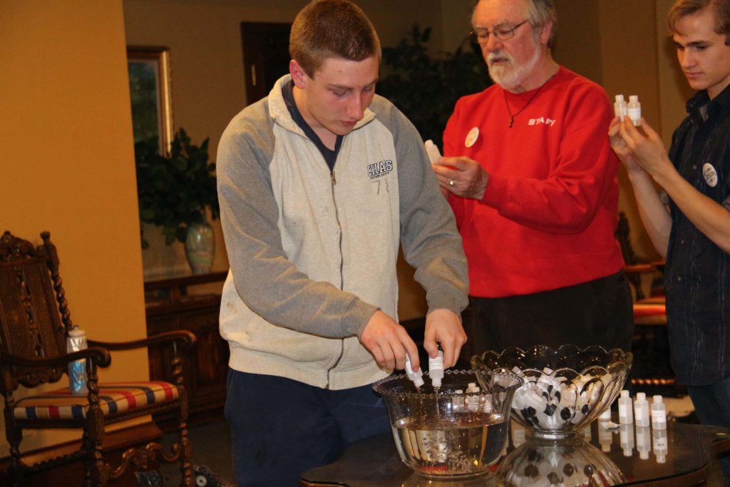 Jordan Jungquist of Grace, Port Huron adds to the common bowl.